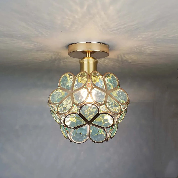 Decorative glass ceiling lamp with elegant floral pattern, perfect for modern home decor.