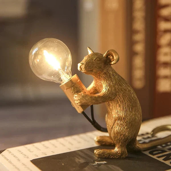 Playful mouse home decor lamp, a unique animal figure lighting piece.