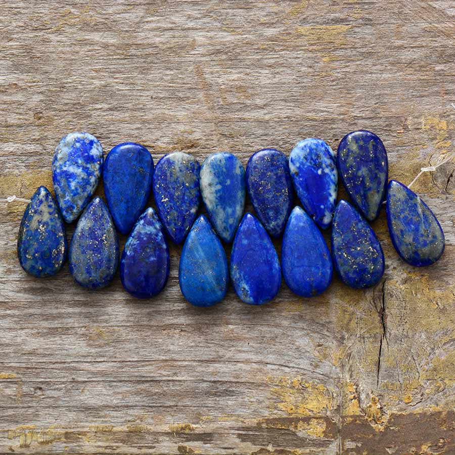 Gold plated drop earrings featuring impressive deep blue lapis lazuli, a statement piece