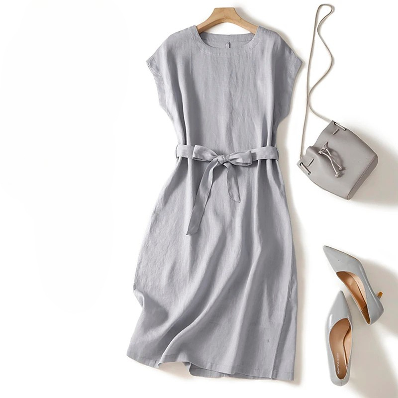 Deep blue Women's Elara Dress, flattering cinched waist & flowing skirt. Versatile for casual or elegant everyday wear.