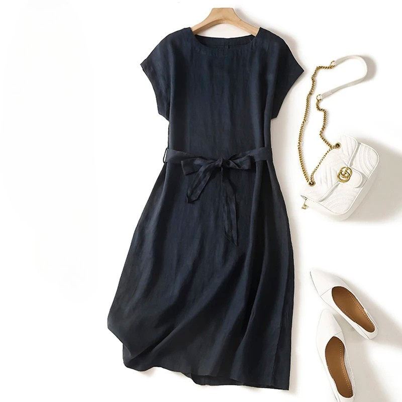Elegant black Elara Dress for women, featuring a cinched waist and flowing versatile style. Perfect for any occasion.