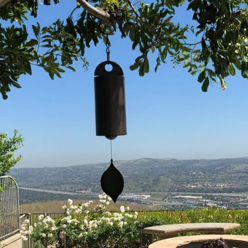 Outdoor wind chime with deep, soothing resonance. Elegant serenity bell metal art for garden & patio decor.