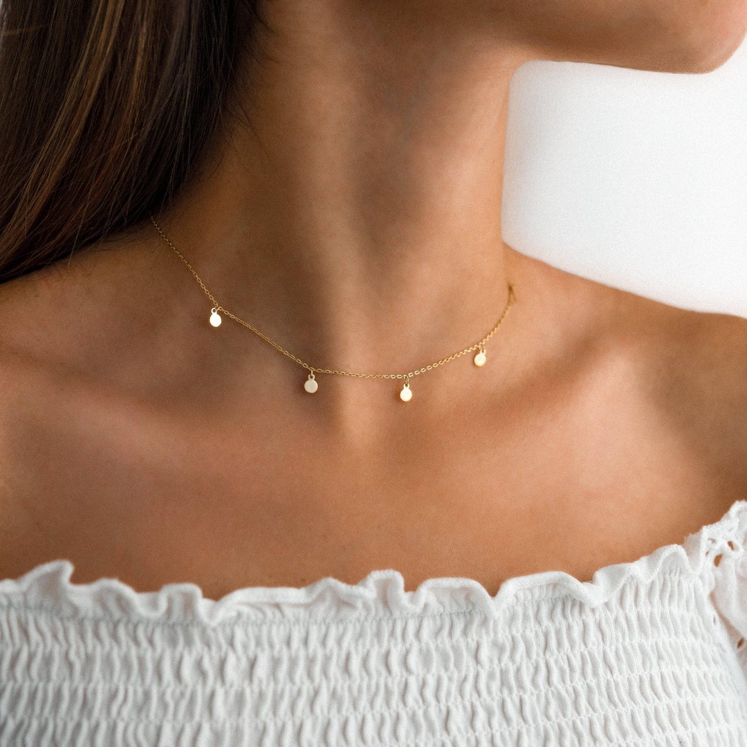 Delicate gold plated silver necklace with a small circle pendant. Minimalist women's jewelry, adjustable chain.