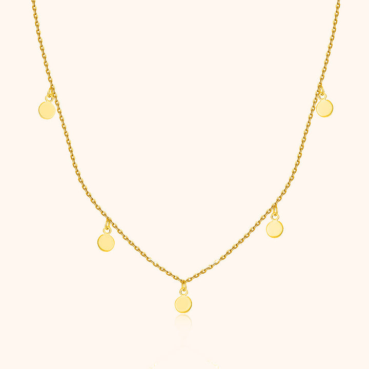 Women's small circle pendant necklace, minimalist design in gold plated sterling silver. Delicate adjustable jewelry gift.