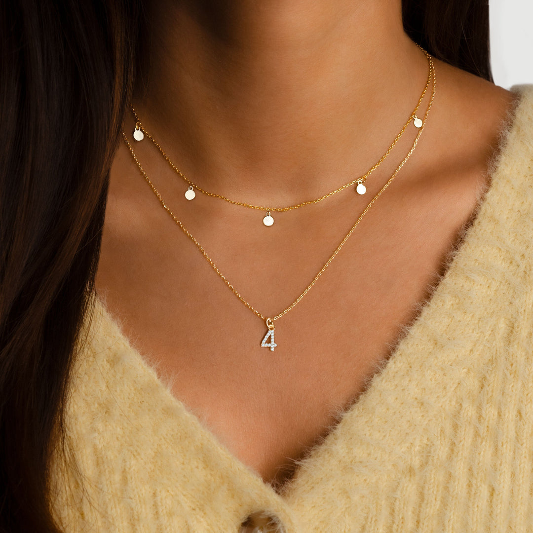 Adjustable women's delicate small circle pendant necklace. Minimalist gold plated silver jewelry, perfect for everyday wear.
