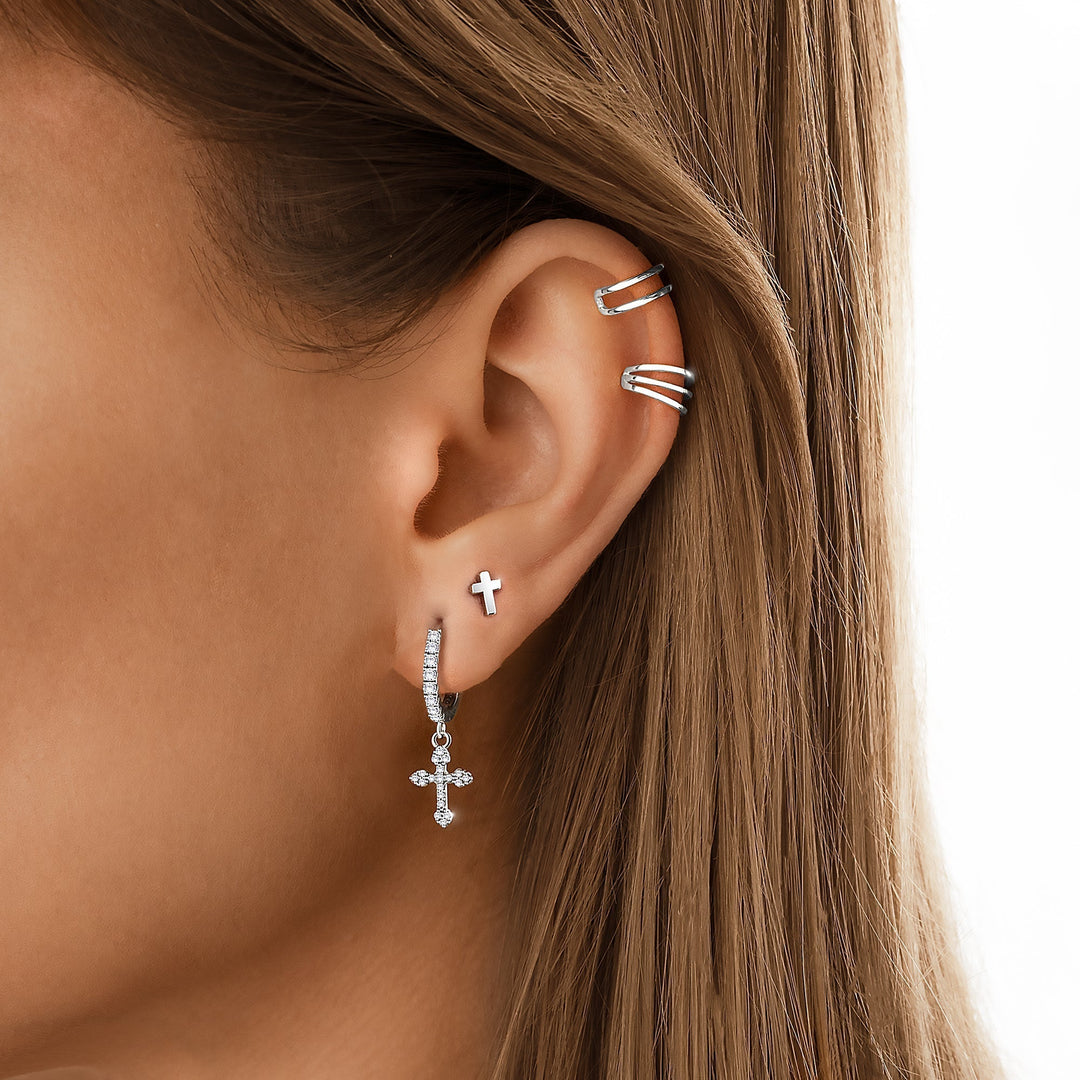 Women's delicate cross stud earrings in gold plated sterling silver, great for everyday fashion.