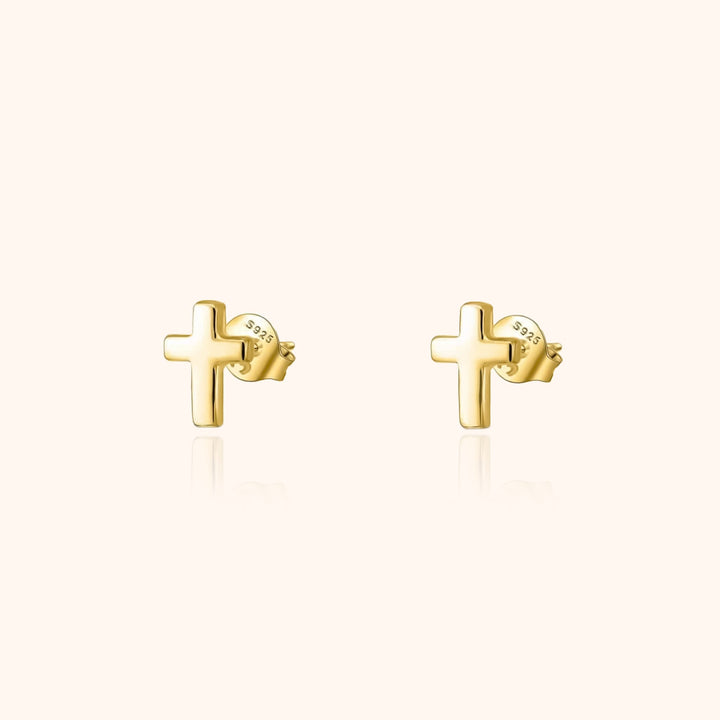 Elegant small cross stud earrings for women, minimalist design in gold plated sterling silver.