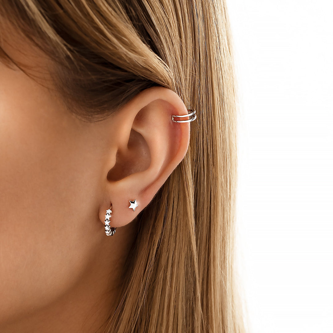 Women's delicate gold plated sterling silver star studs, minimalist celestial earrings for everyday wear.