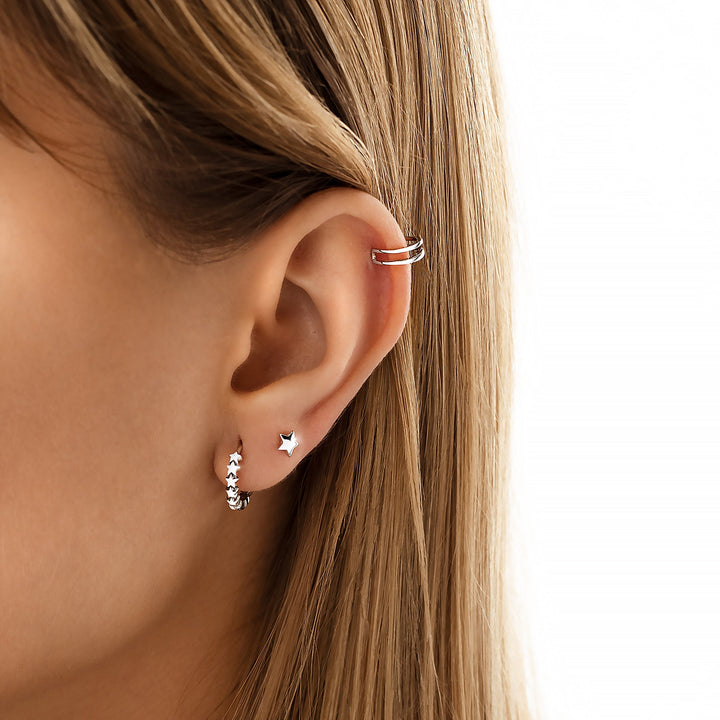 Women's delicate gold plated sterling silver star studs, minimalist celestial earrings for everyday wear.