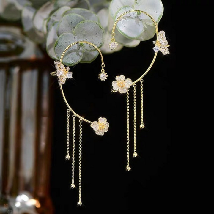Aurelia butterfly drop earrings, combining unique design with delicate silver and gold elements