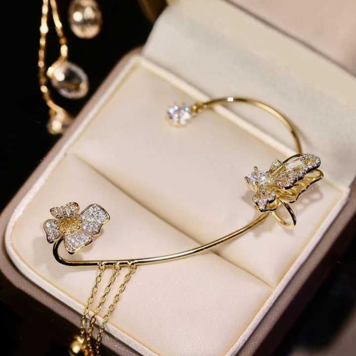 Detailed view of a unique silver butterfly earring, highlighting its delicate craftsmanship