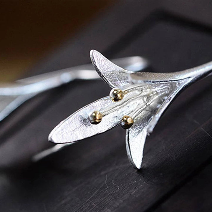 Shimmering silver flower petal earrings for women, a delicate and elegant floral jewelry piece.
