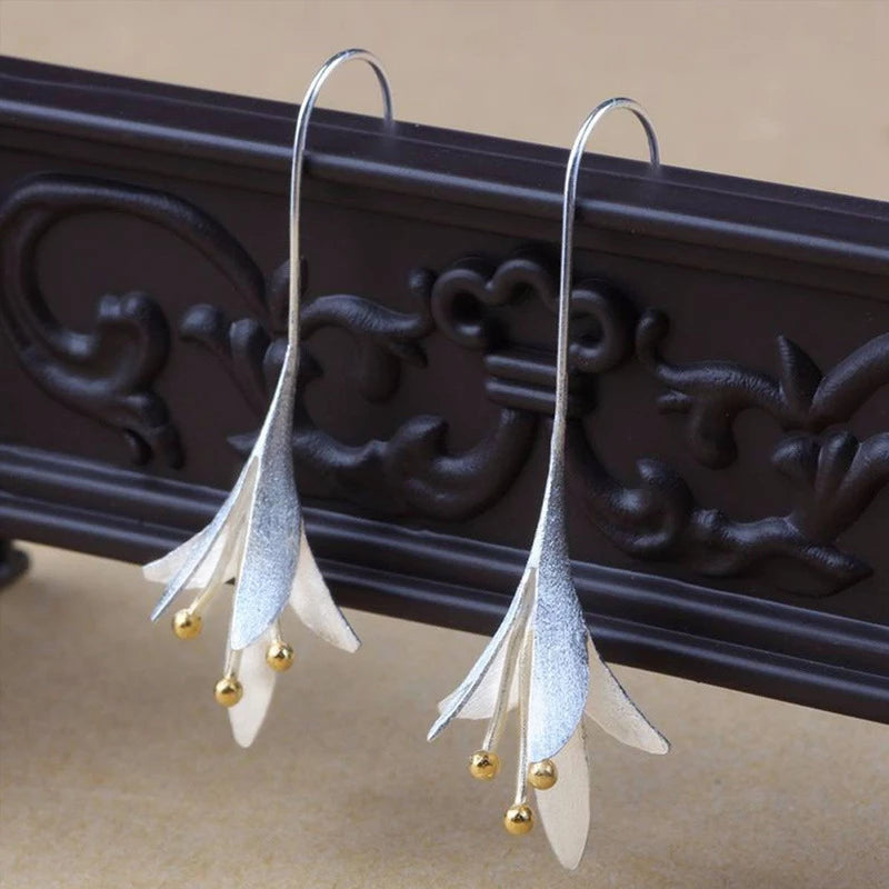Beautiful women's silver flower petal earrings, elegant and delicate floral jewelry perfect for a gift.
