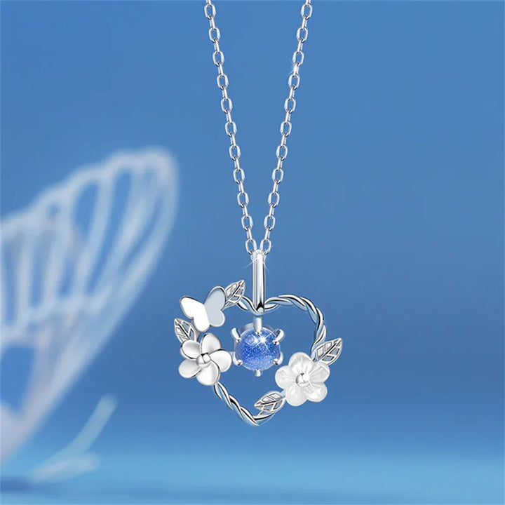 Delicate silver seashell flower heart necklace for women, an elegant ocean-inspired charm.