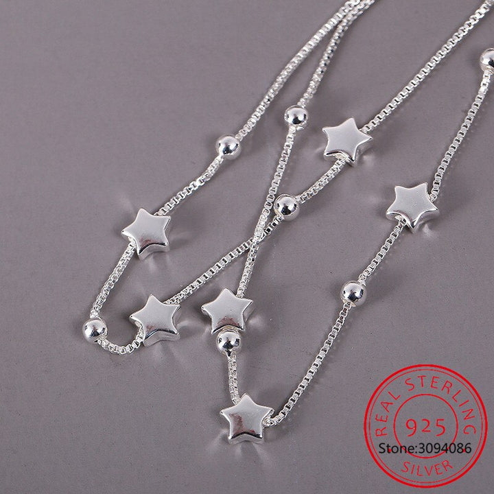 Elegant women's adjustable bracelet with a delicate star charm, perfect for minimalist everyday wear. Sterling silver gift.
