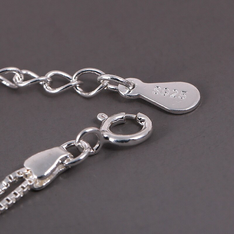 Minimalist women's adjustable bracelet featuring a delicate sterling silver star charm. Elegant and versatile everyday wear.