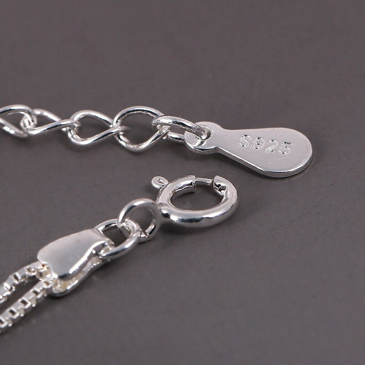 Minimalist women's adjustable bracelet featuring a delicate sterling silver star charm. Elegant and versatile everyday wear.