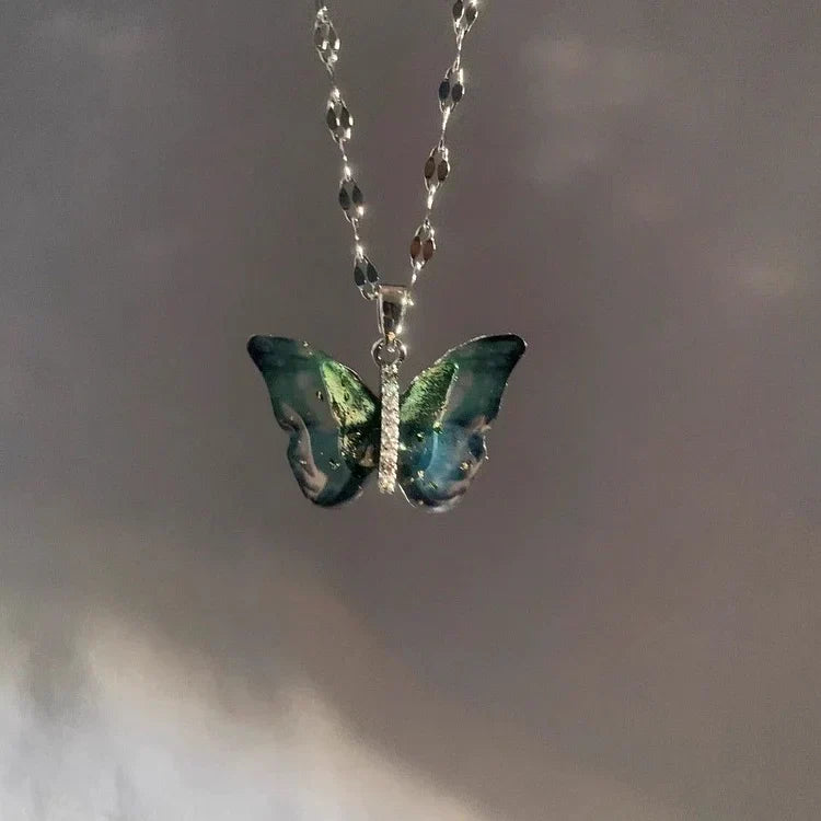 Elegant women's blue butterfly necklace crafted from sterling silver. Dainty and delicate, ideal for a stylish, fantasy-inspired look.