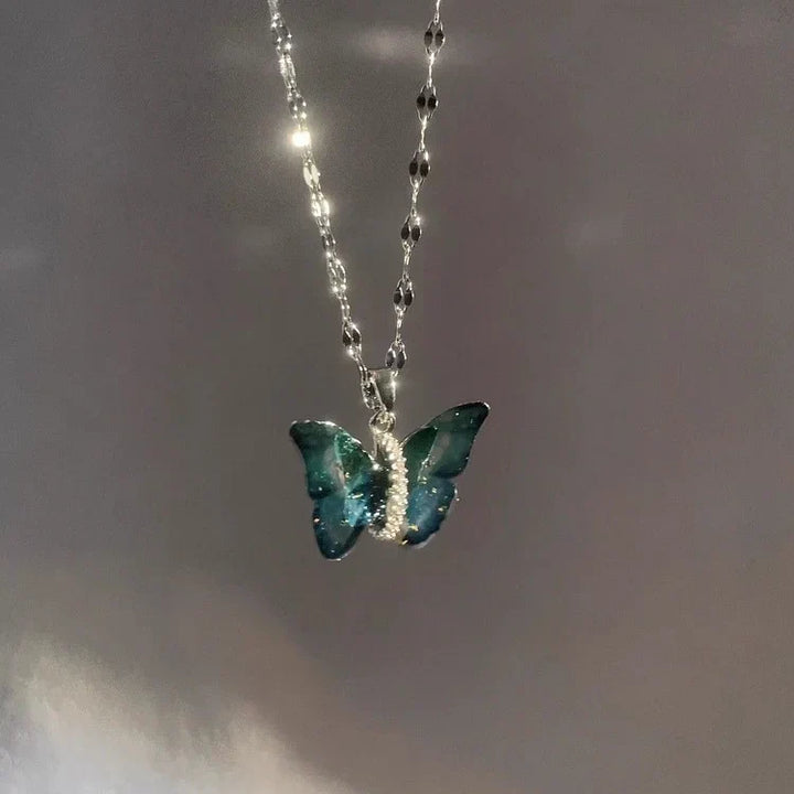 Charming sterling silver blue butterfly necklace, a unique and delicate gift for women. Elegant animal jewelry with a fantasy touch.