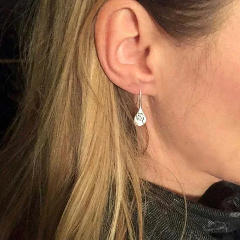 Close-up of elegant 925 sterling silver dandelion stud earrings, ideal for women's everyday wear.