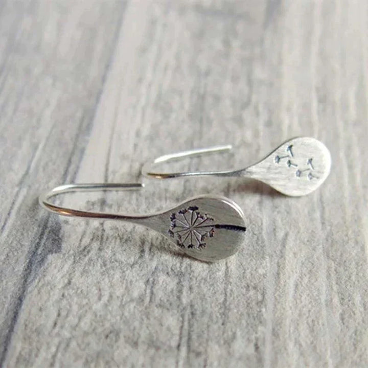 Wish-fulfilling sterling silver dandelion stud earrings, delicate & nature-inspired fine jewelry for women.