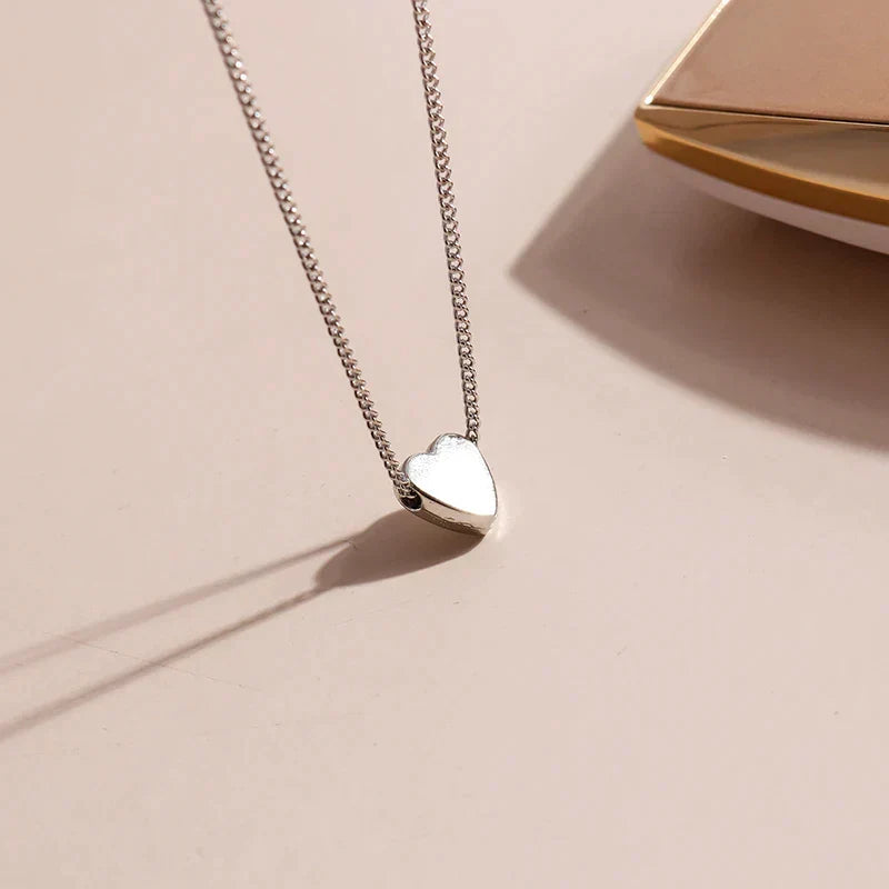 Womens minimalist smooth heart necklace, sterling silver. Delicate & elegant, a perfect timeless accessory gift for her.