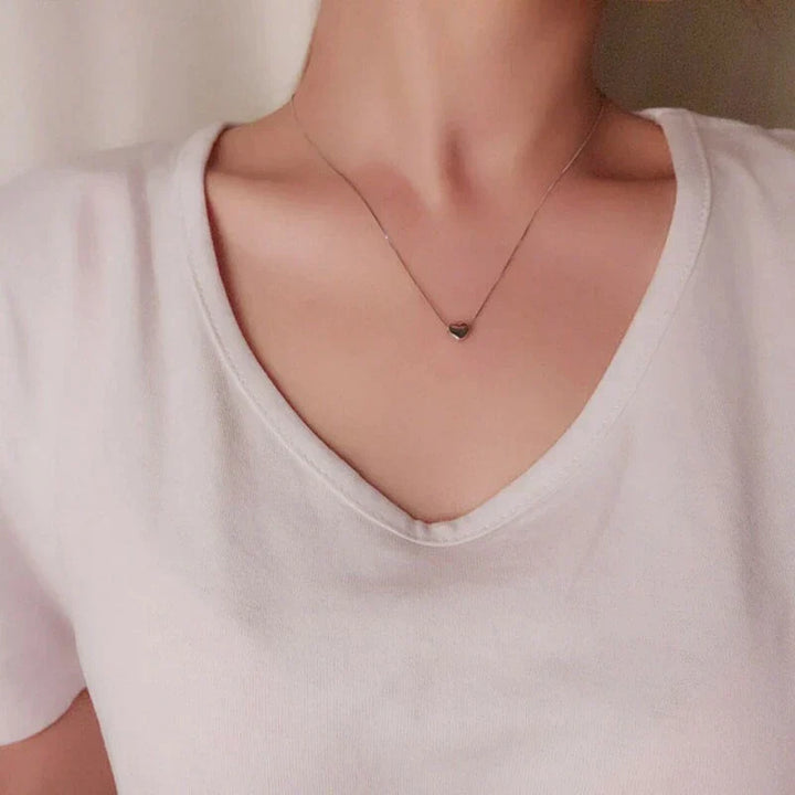 Timeless sterling silver heart necklace. This elegant, minimalist womens jewelry features a smooth, delicate design.