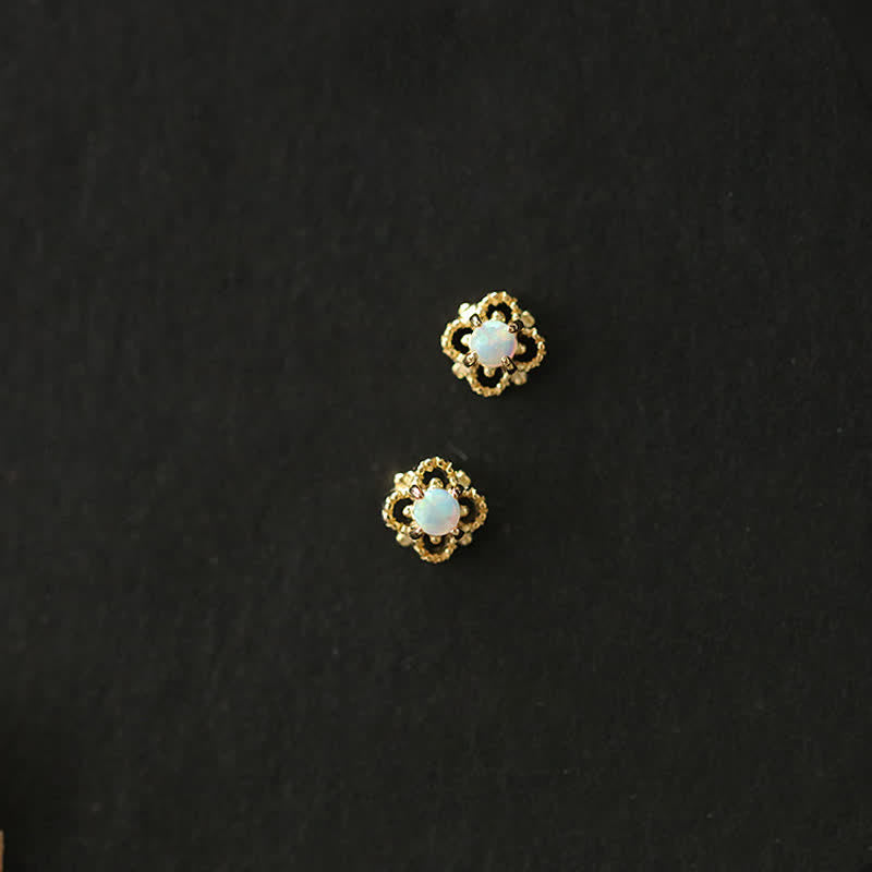 Pair of delicate vintage opal drop earrings for women, elegant and timeless.