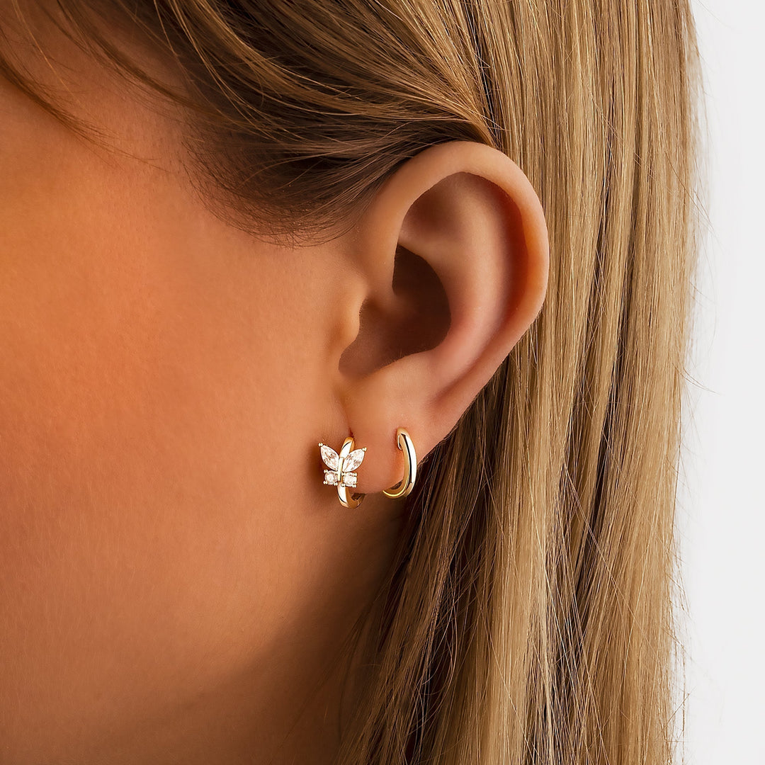 Sparkling crystal butterfly hoop earrings for women, featuring sterling silver & gold-plated delicate design.