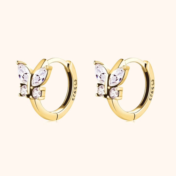 Elegant silver & gold-plated hoop earrings with crystal butterflies. Perfect delicate jewelry gift for her.