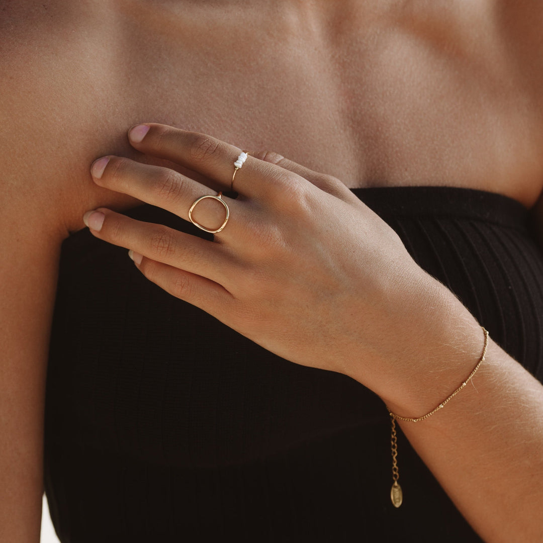 Women's subtle beaded bracelet, Liora, worn on a wrist, ideal for stackable and everyday minimalist chic accessory.