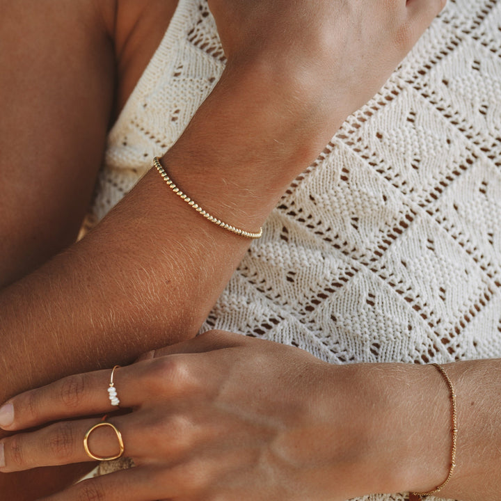 Adjustable women's Liora subtle beaded bracelet, a delicate & minimalist chic accessory for versatile everyday wear.