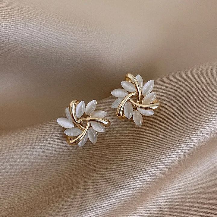 Delicate women's opal petal drop earrings. Nature-inspired design, elegant fashion accessory for her. Perfect gift.