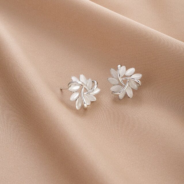 Elegant women's opal drop earrings feature a delicate petal design. Nature-inspired fine jewelry, ideal gift for her.