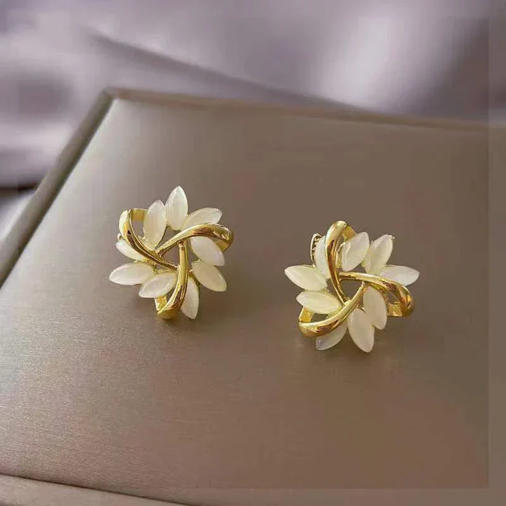 Stunning women's delicate opal petal drop earrings. Elegant, nature-inspired fashion jewelry, a perfect gift for her.