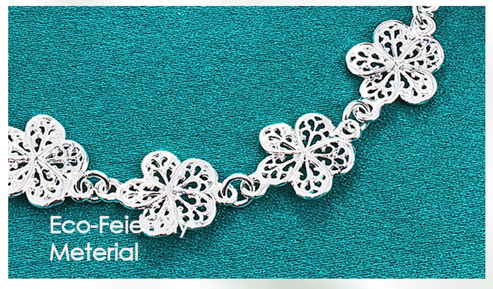 Intricate silver filigree bracelet, delicate women's jewelry with an elegant, adjustable design.