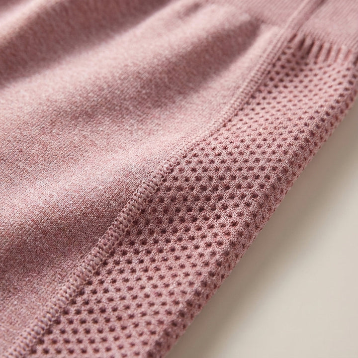 Close-up of fabric on Delilah sculpting high-waisted leggings, premium athletic wear