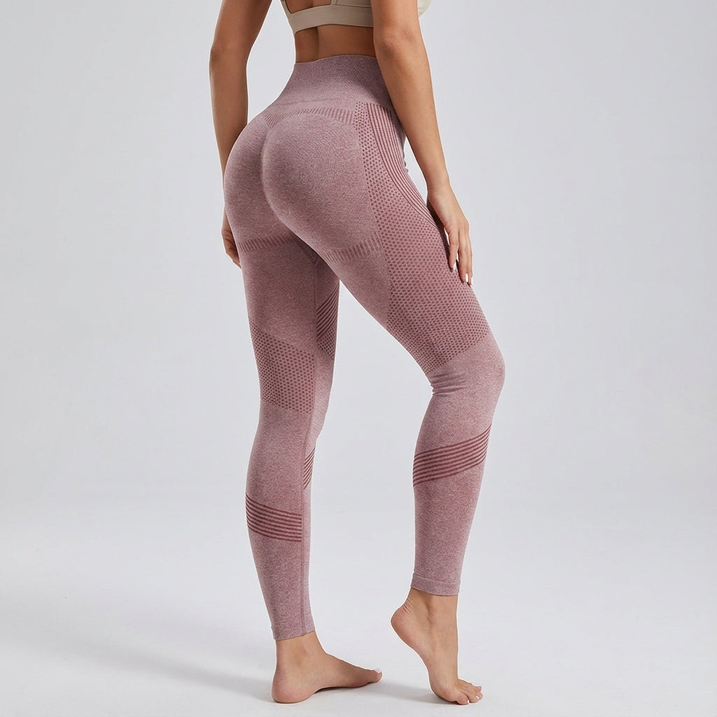 Woman wearing high-waisted sculpting sports leggings during a workout, flexible yoga pants