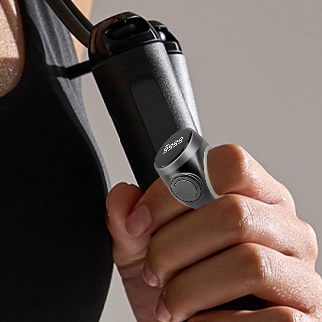 Product shot of a single digital finger counter ring, angled view