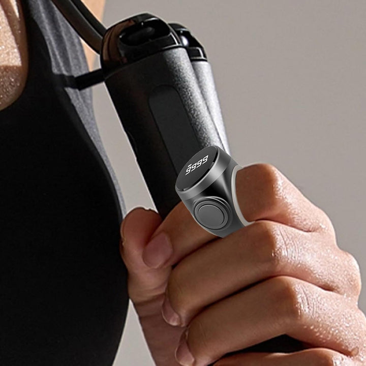 Product shot of a single digital finger counter ring, angled view