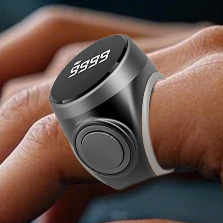 Backlit display of a digital finger counter ring, visible in low light