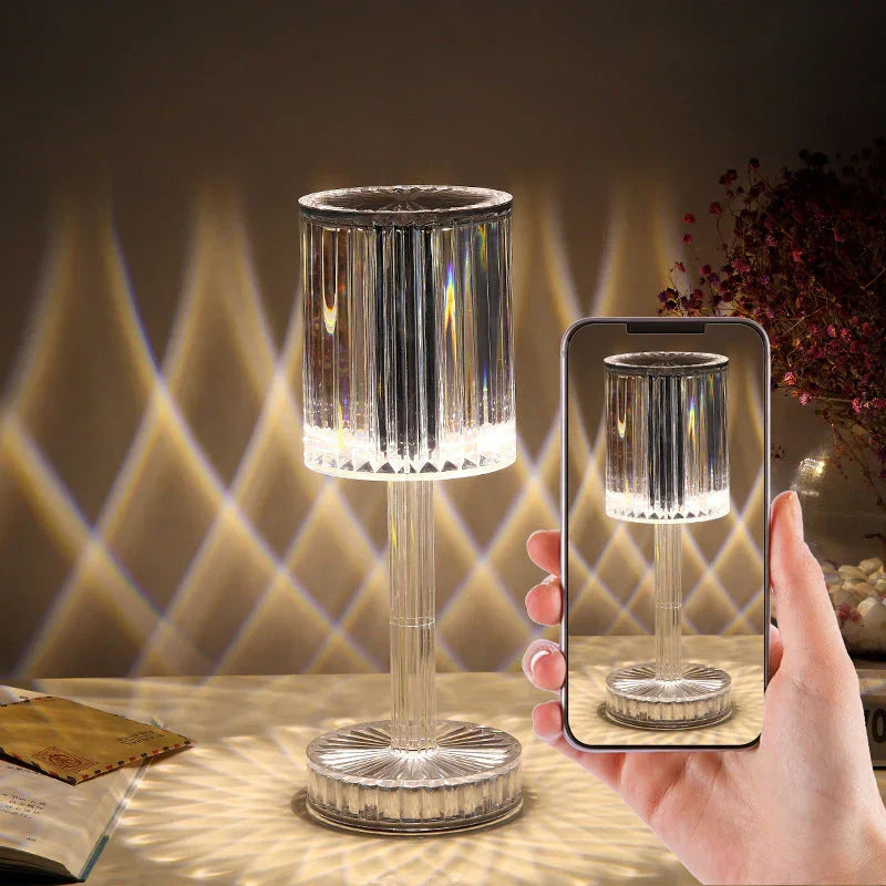 Decorative modern crystal table lamp with dimmable LED. Creates a beautiful ambient glow for any room.