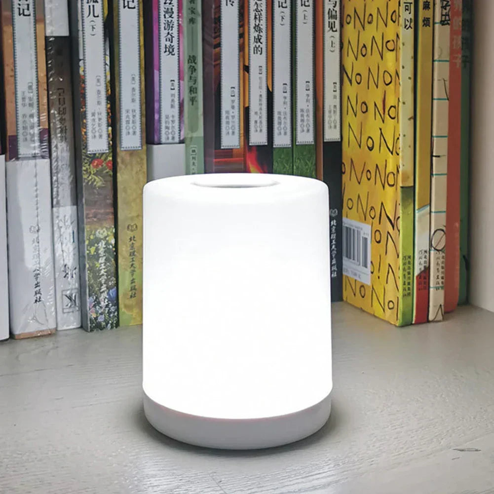 Dimmable LED desk lamp with USB charging port. Modern design for home office, study, or bedside.