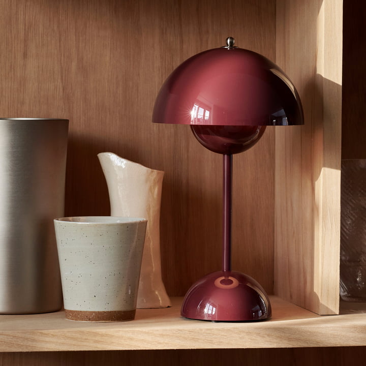 Modern LED table lamp with MoonGlow effect, offering adjustable brightness for ambient home lighting.