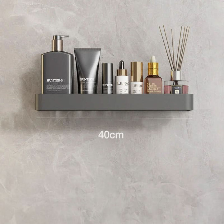 Organize your bathroom with this wall-mounted, drill-free shelf & towel bar for essentials.