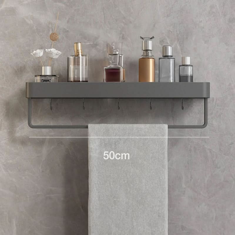 Hold shampoos, soaps & towels with this modern drill-free bathroom shelf & towel bar.