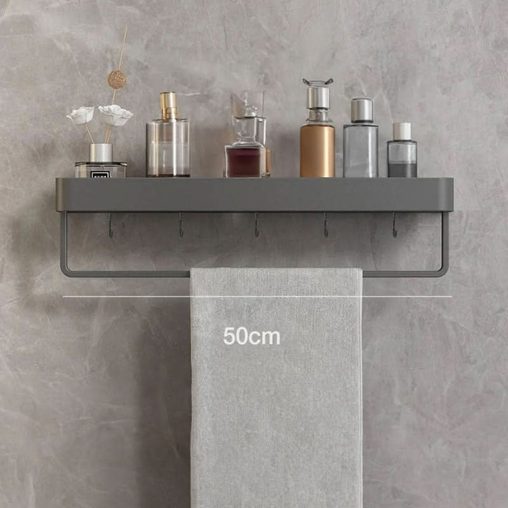 Hold shampoos, soaps & towels with this modern drill-free bathroom shelf & towel bar.
