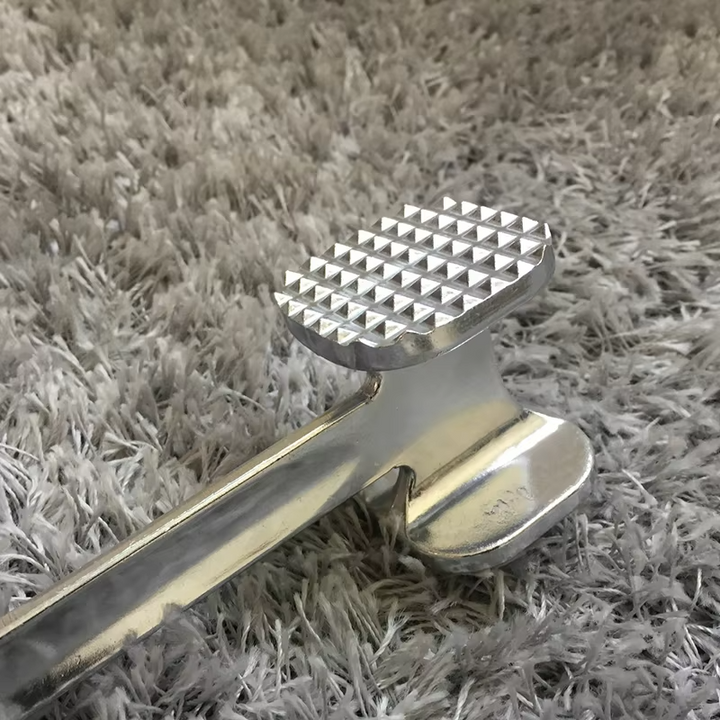 Dual-sided meat tenderizer hammer for beef, chicken, & pork. Heavy-duty mallet for tenderizing and flattening.