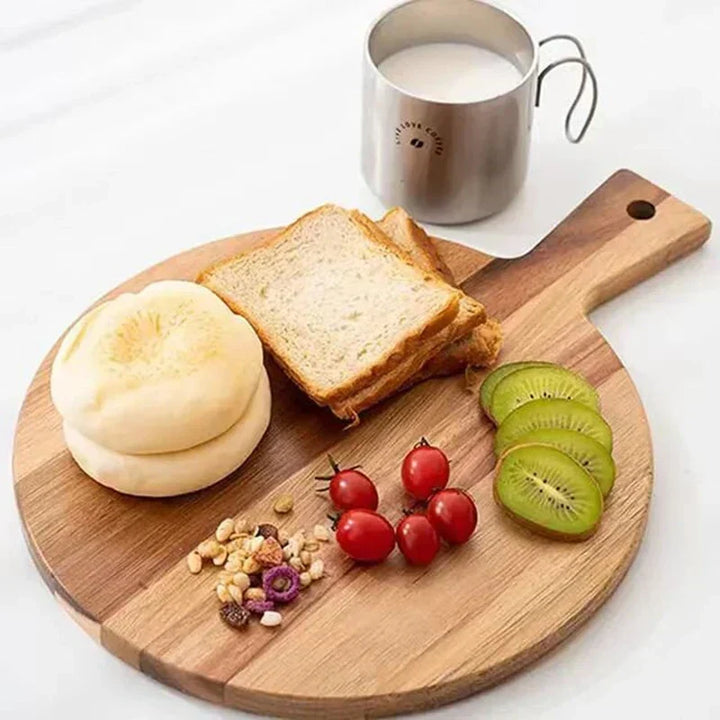 Premium acacia wood pizza peel and serving board. Versatile for baking, entertaining, charcuterie in the kitchen.
