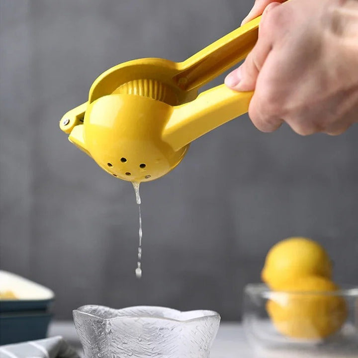 Sturdy aluminum manual lemon press for efficient juice extraction, a must-have kitchen tool.